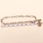 Preview: Versilbertes Bettelarmband an einem Maßband zur Veranschaulichung der Länge von 20 cm und 22 cm mit Engel.