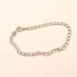 Preview: Ausgebreitetes silbriges Bettelarmband aus leichtem Aluminium mit großen Gliedern und Karabiner-Verschluss..