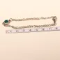 Preview: Versilbertes Bettelarmband an einem Maßband zur Veranschaulichung der Gesamtlänge von 19 cm.
