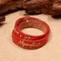 Preview: Rotes Kinder Trachtenarmband aus Kunstleder mit Stickerei Alpenglück und bunten Blumen.