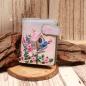 Preview: Kleiner Geldbeutel aus Kunstleder mit buntem Vogelhaus- und Blumen-Motiv sowie Magnetverschluss.