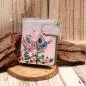 Preview: Kleiner Geldbeutel aus Kunstleder mit buntem Vogelhaus- und Blumen-Motiv sowie Magnetverschluss.