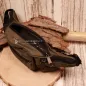 Preview: Draufsicht auf die geöffnete olivgrüne Kinder-Bauchtasche zur Verdeutlichung der geräumigen Fächer-Einteilung.