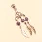 Preview: Versilberter Kettenanhänger Traumfänger mit lila Glitzerperle und drei beweglichen Metallfedern.