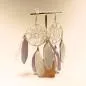 Preview: Handgefertigter Modeschmuck mit Hasenmotiv aus versilbertem Metall.