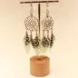 Preview: Handgefertigter Modeschmuck mit Hasenmotiv aus versilbertem Metall.