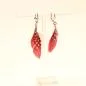 Preview: Handgefertigter Modeschmuck mit Hasenmotiv aus versilbertem Metall.