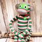 Preview: Riesiger XXL Sockenaffe von HickUps, grün-rot-creme gestreift, 72 cm große Stoffpuppe aus Fair Trade Handarbeit.
