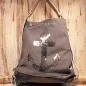 Preview: Grauer Rucksack aus Stoff mit silbernem Anker aus Pailletten, braunem Lederboden und gestreiften Gurten, 3-in-1 Funktion als Handtasche.
