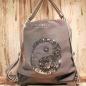 Preview: Grauer Rucksack aus Stoff mit silbernem Ying & Yang Symbol aus Pailletten, Lederboden und gestreiften Gurten, 3-in-1 Funktion als Handtasche.