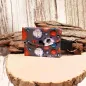 Preview: Handgenähtes farbenfrohes Schlüsselmäppchen von chic-peppig-bunt mit Kunststoff-Druckknopf und silbernem Schlüsselring auf hellem Hintergrund.