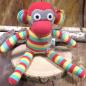 Preview: Kuscheltier Affe in gelb rot Streifen Preview: Kuscheltier Affe in gelb rot Streifen