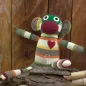 Preview: Kuscheltier Sockenaffe in den Farben grün, grau und orange