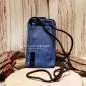 Preview: Rückseite der blauen Leder Handytasche mit der Aufhängung für das schwarze Segelseil.