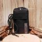 Preview: Schwarze Bench Handytasche aus Leder mit Magnetverschluss und Marken-Schriftzug.