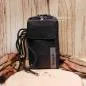 Preview: Schwarze Bench Handytasche aus Leder mit Magnetverschluss und Marken-Schriftzug.