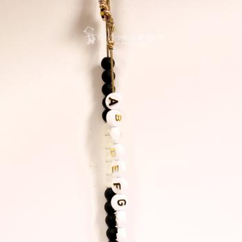 ABC Rechenkette Perlen schwarz-weiss vergoldet