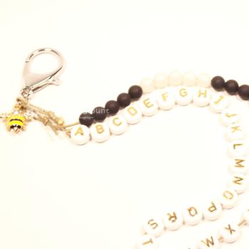 ABC Rechenkette Perlen schwarz-weiss vergoldet