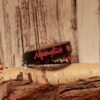 Zwei silberne Druckknöpfe zur Längenverstellung am 40 cm langen schwarzen Trachtenaccessoire.