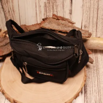 Draufsicht auf die geöffnete dunkelblaue Kinder-Bauchtasche zur Veranschaulichung der praktischen Fächer-Einteilung.