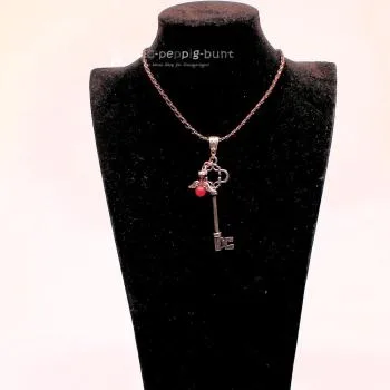 Kettenanhänger Schlüssel mit Schutzengel pink versilbert - kettenanhaenger schluessel engel pink strass steine