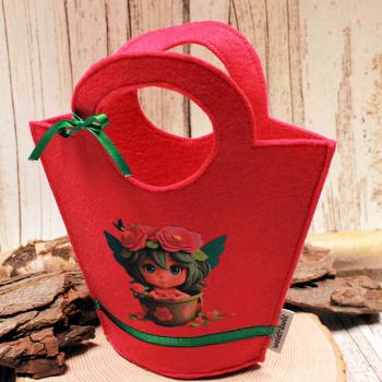 Handgenähte pinke Kindertasche aus Filz mit gepresstem Feen-Motiv, runden Griffen und kleiner Schleife der Marke weidräwöl.