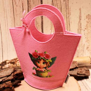 Handgenähte rosa Kindertasche aus Filz mit gepresstem Feen-Motiv, runden Griffen und kleiner Schleife der Marke weidräwöl.