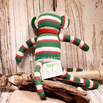 Mittlerer Affe als Stofftier mit bunten Streifen