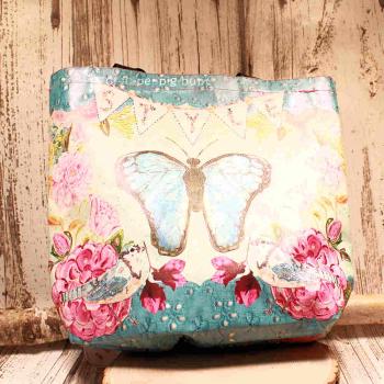 Große türkise Shoppertasche aus Kunstleder mit sichtbarem pinken Innenfutter, langem Schulterriemen und Reißverschlussfach auf hellem Hintergrund.