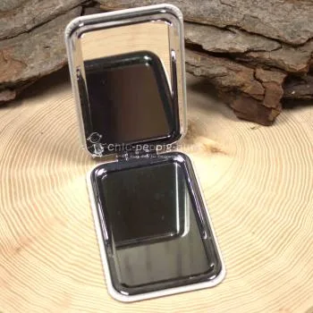 Handspiegel mit Motiv, geöffnet, zeigt Normal- und Vergrößerungsspiegel
