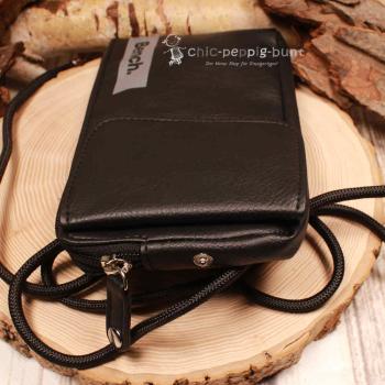 Nahaufnahme des Druckknopfs, der den Reißverschluss-Zipper der Bench Tasche sichert.