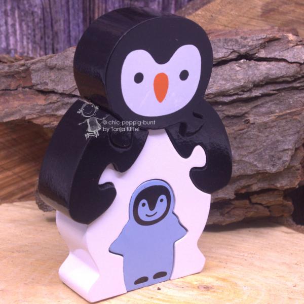 Holzpuzzle 3 D als Pinguin  mit Baby orange