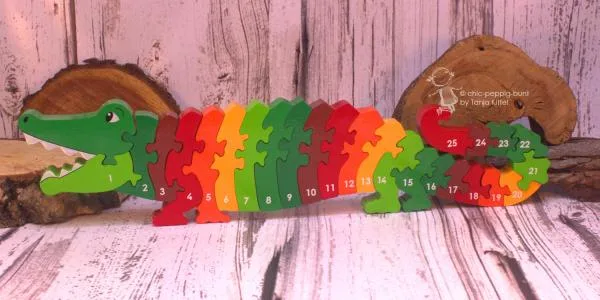 Holz Puzzle als Krokodil mit Zahlen von 1-25