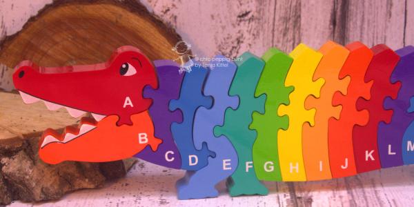 buntes Holz Puzzle in 3D als Krokodil buntes Holz Puzzle in 3D als Krokodil