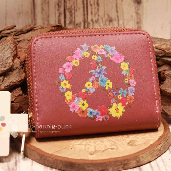Kleiner Geldbeutel aus Kunstleder mit buntem Peace-Zeichen und Blumen sowie Reißverschluss.