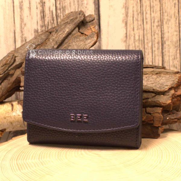 Geldbörse unisex aus dunkelblauem Leder mit Druckknopfverschluss geschlossen. Geldbörse unisex aus dunkelblauem Leder mit Druckknopfverschluss geschlossen.