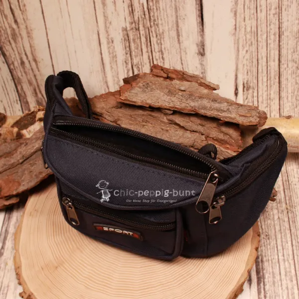 Draufsicht auf die geöffnete dunkelblaue Kinder-Bauchtasche zur Veranschaulichung der praktischen Fächer-Einteilung.