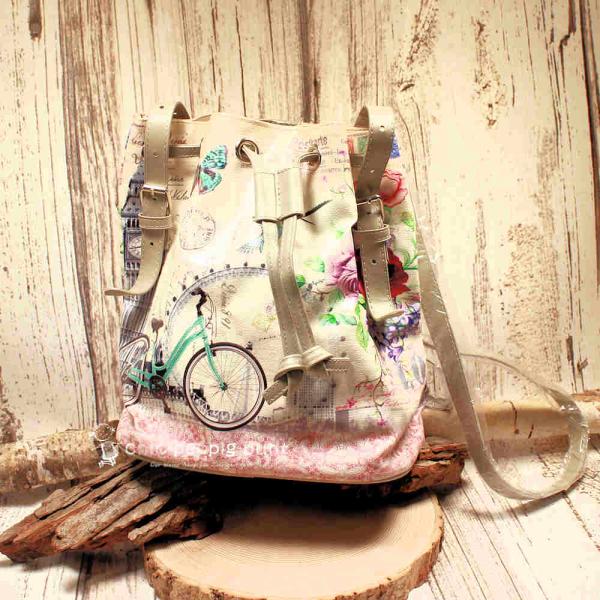 Beutel-Handtasche aus Kunstleder mit verstellbaren Schulterriemen, Innenfutter und separatem Handyfach vor neutralem Hintergrund.