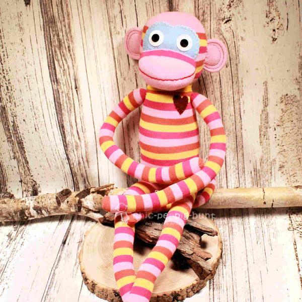Riesiger XXL Sockenaffe von HickUps in Rosa, Pink und Gelb, handgefertigte Stoffpuppe aus Fair Trade Produktion, Länge 72 cm.