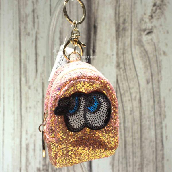 Glitzerndes Schlüsselanhänger Mäppchen mit Motiv in Aprikot-Rosa, Reißverschlussfach.