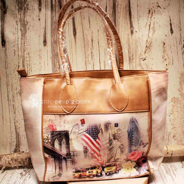 Große braune Shoppertasche aus Kunstleder mit Amerika-Motiv, Freiheitsstatue und New York Skyline, Ansicht von vorne und innen.
