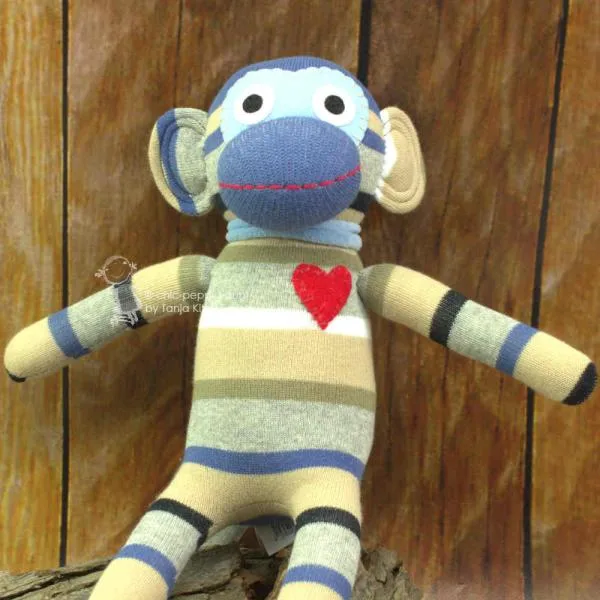Kuscheltier Sockenaffe in beige/blau Streifen