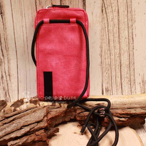 Pinke Leder Handtasche mit Sicherheits-Druckknopf am Reißverschluss-Zipper.