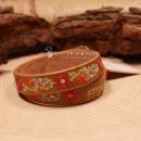 Braunes Kinder Trachtenarmband aus Kunstleder mit Stickerei Alpenglück und Blumen.