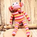 Mittlerer Sockenaffe von HickUps in Rosa, Pink und Gelb, handgefertigtes Fair Trade Stofftier, Größe 40 cm.