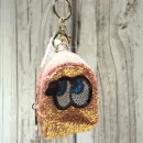 Glitzerndes Schlüsselanhänger Mäppchen mit Motiv in Aprikot-Rosa, Reißverschlussfach.