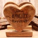 Rustikaler Serviettenspender aus Holz in Herzform mit dunkel eingebranntem Schriftzug Alpenglück.
